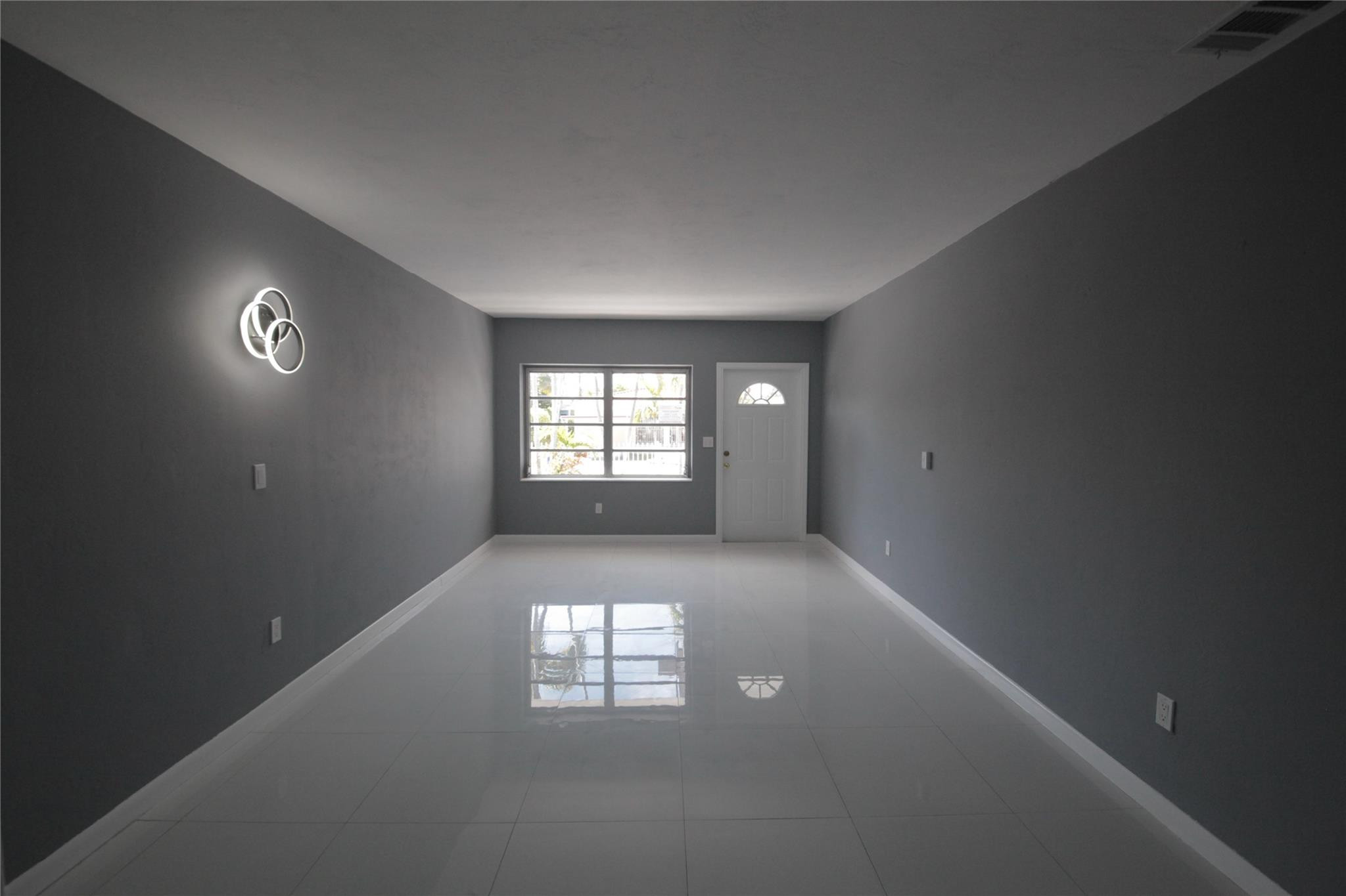 2221 Southwest 13th Street Miami, FL 33145 - Photo 3 of 24 an empty room that has a window
