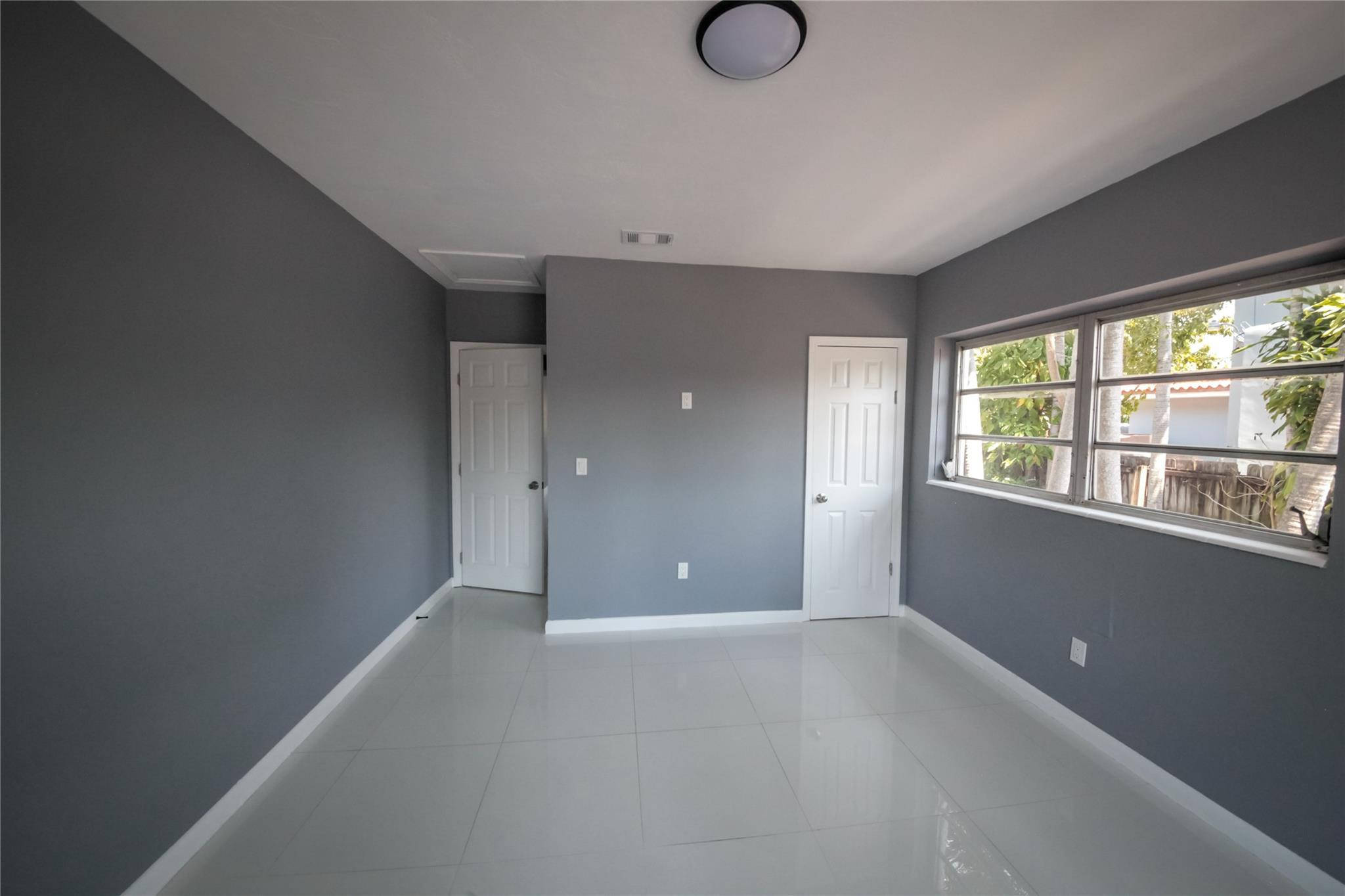 2221 Southwest 13th Street Miami, FL 33145 - Photo 9 of 24 an empty room with windows