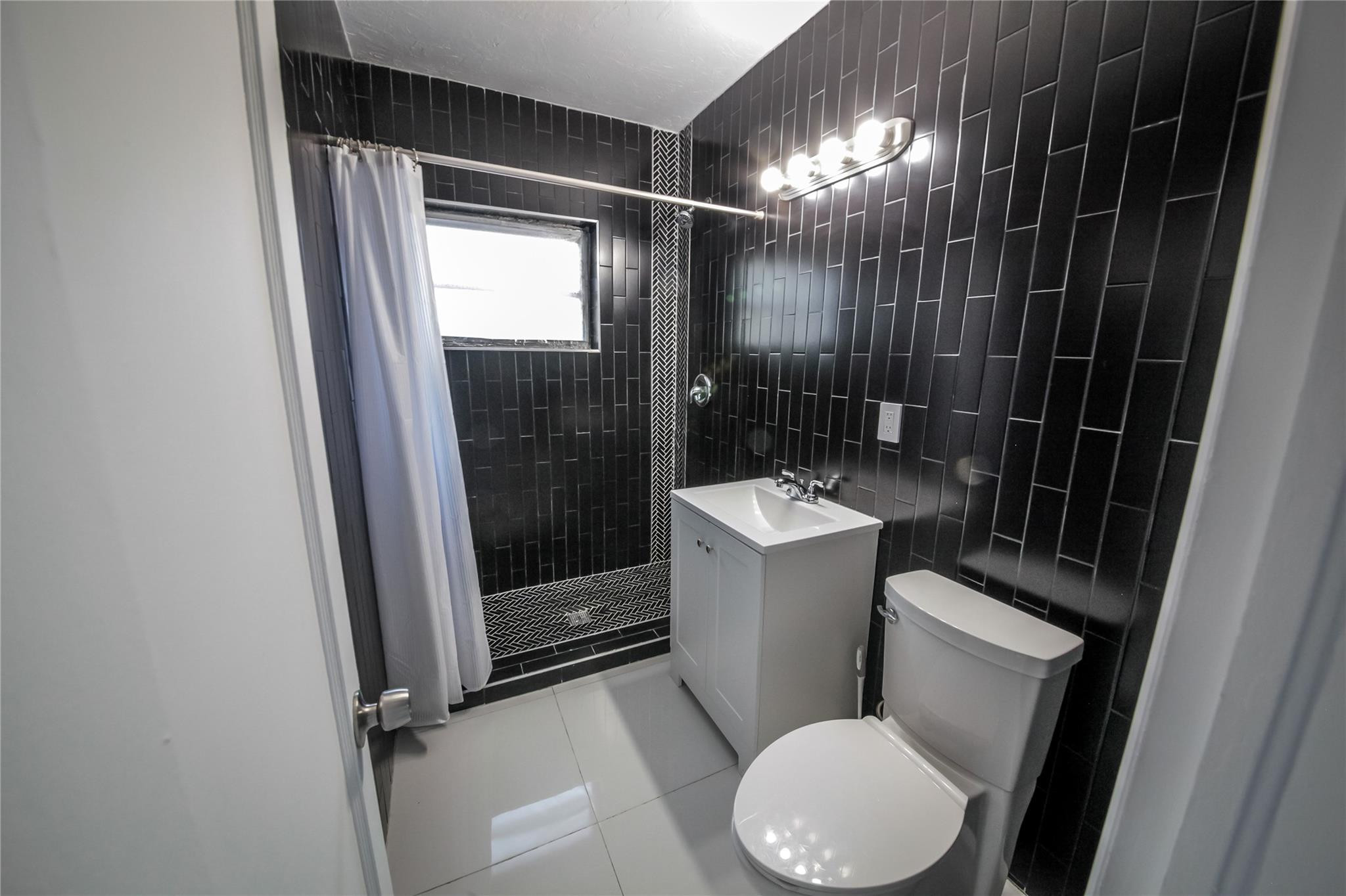 2221 Southwest 13th Street Miami, FL 33145 - Photo 10 of 24 a bathroom with a toilet and a sink