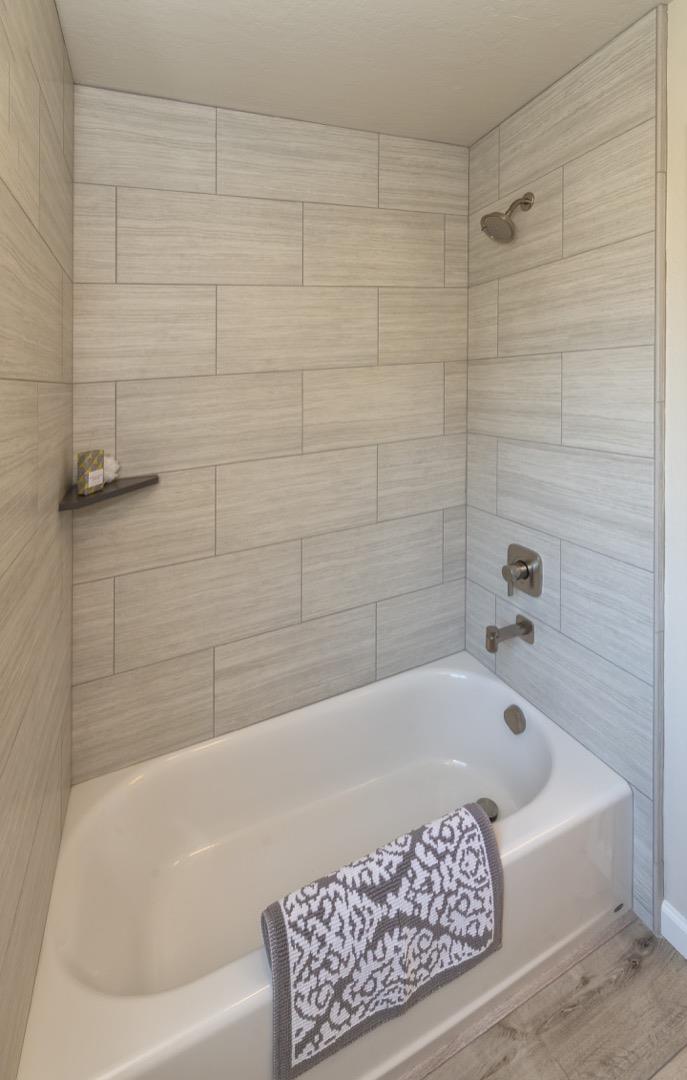 134 Hughes Road Watsonville, CA 95076 - Photo 12 of 26 a bathroom with a bathtub and shower