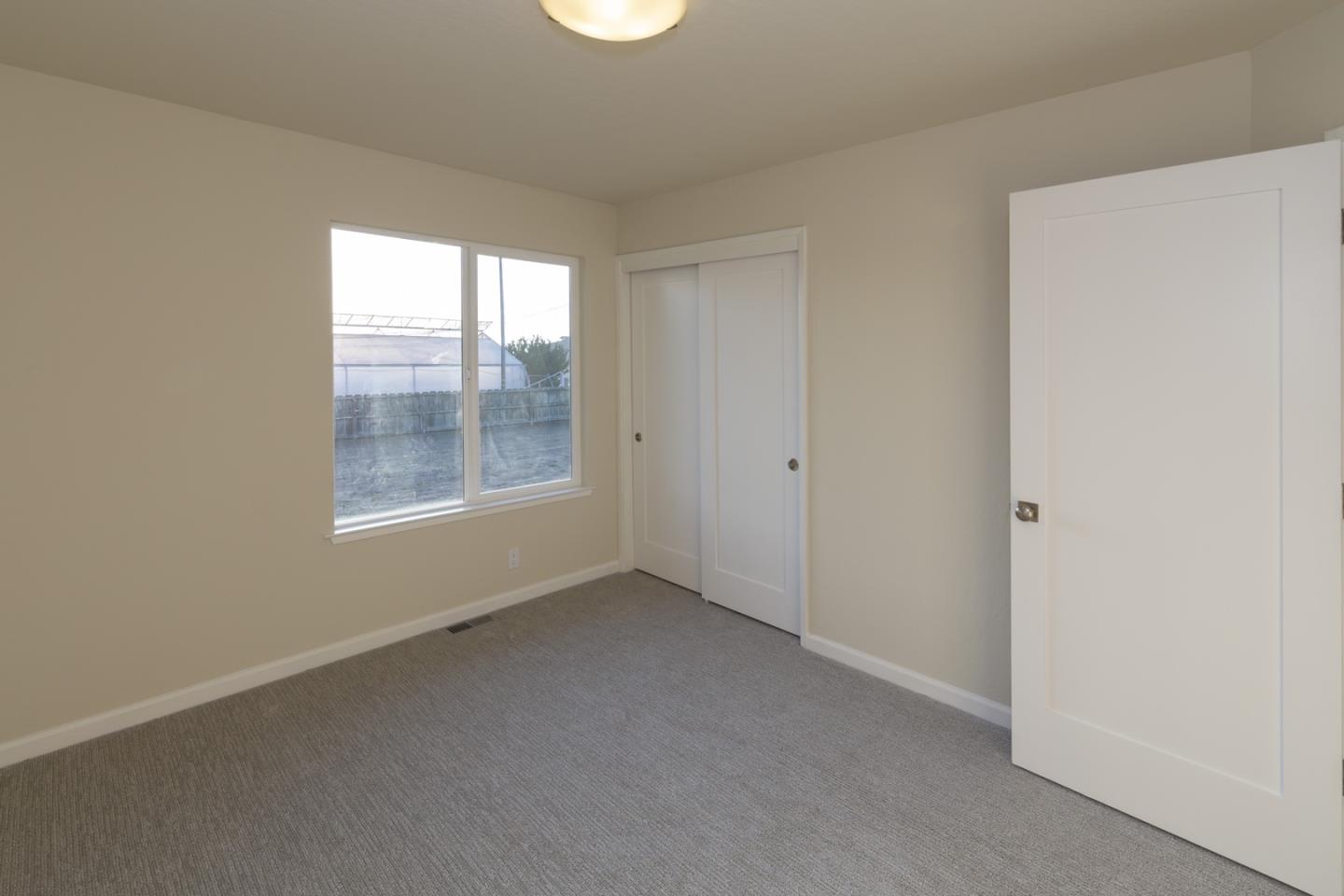 134 Hughes Road Watsonville, CA 95076 - Photo 13 of 26 a view of an empty room with a window
