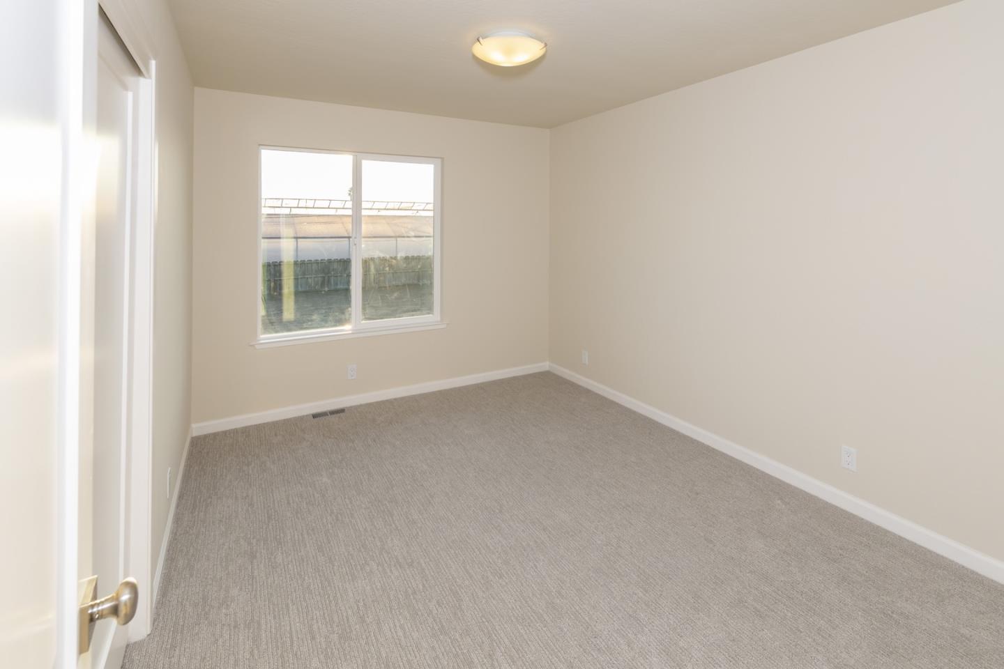 134 Hughes Road Watsonville, CA 95076 - Photo 14 of 26 an empty room with a window