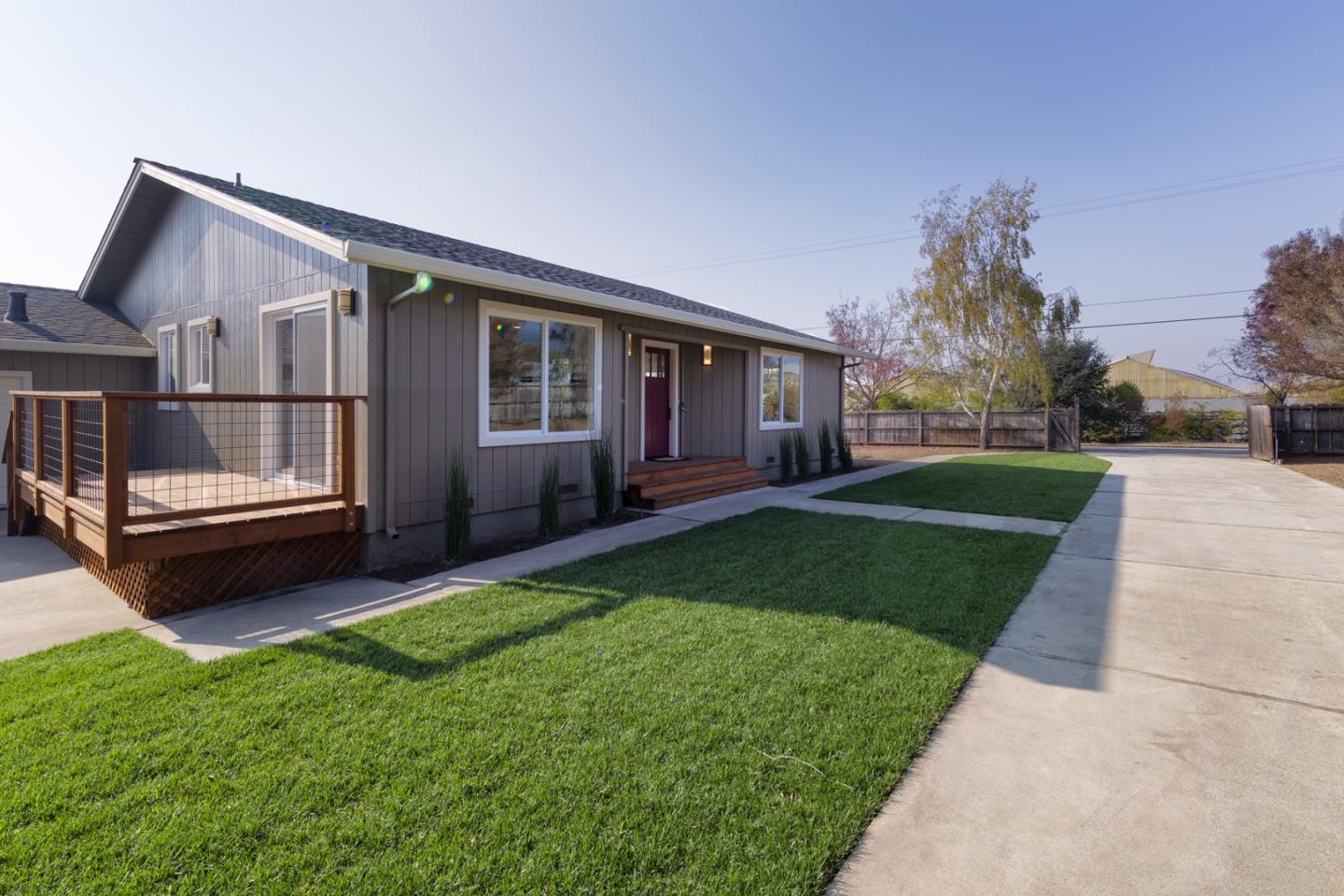 134 Hughes Road Watsonville, CA 95076 - Photo 19 of 26 a view of a house with a yard and deck