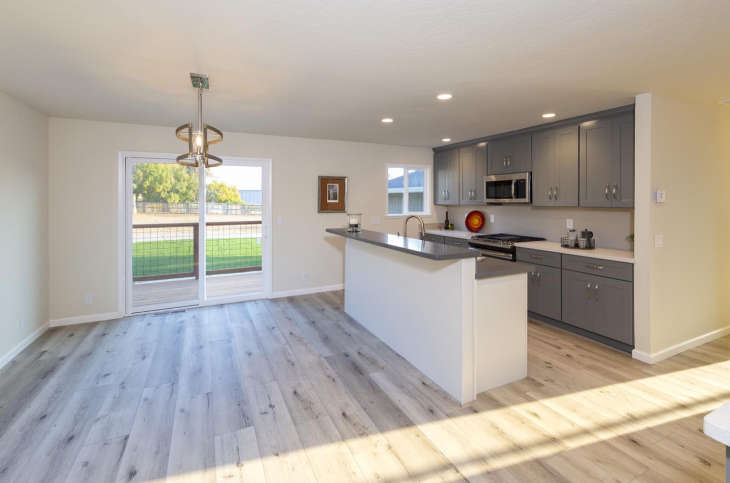 134 Hughes Road Watsonville, CA 95076 - Photo 5 of 26 a kitchen with a sink a window and cabinets