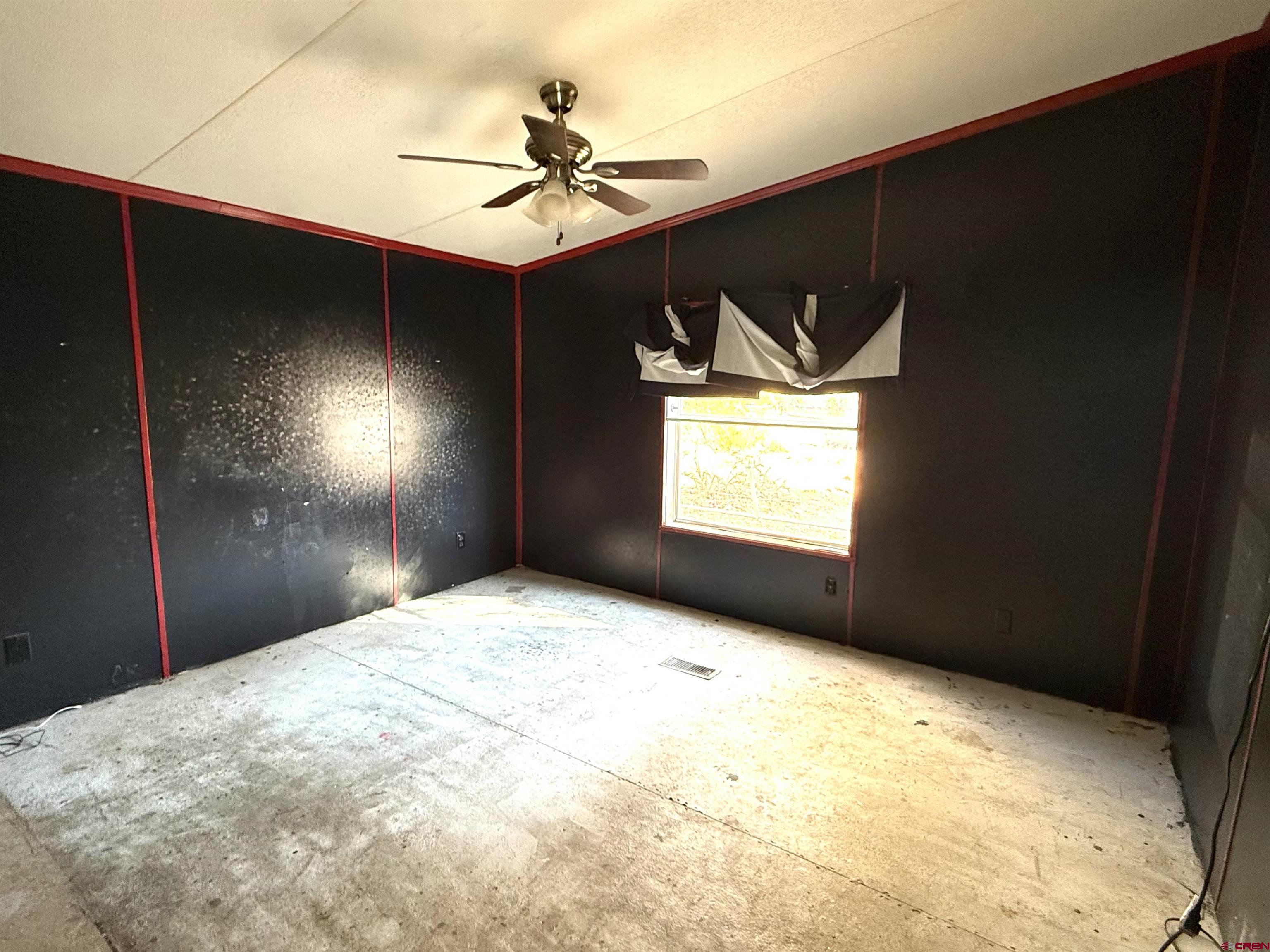 519 South Beech Street Cortez, CO 81321 - Photo 4 of 12 a very nice looking room with a ceiling fan