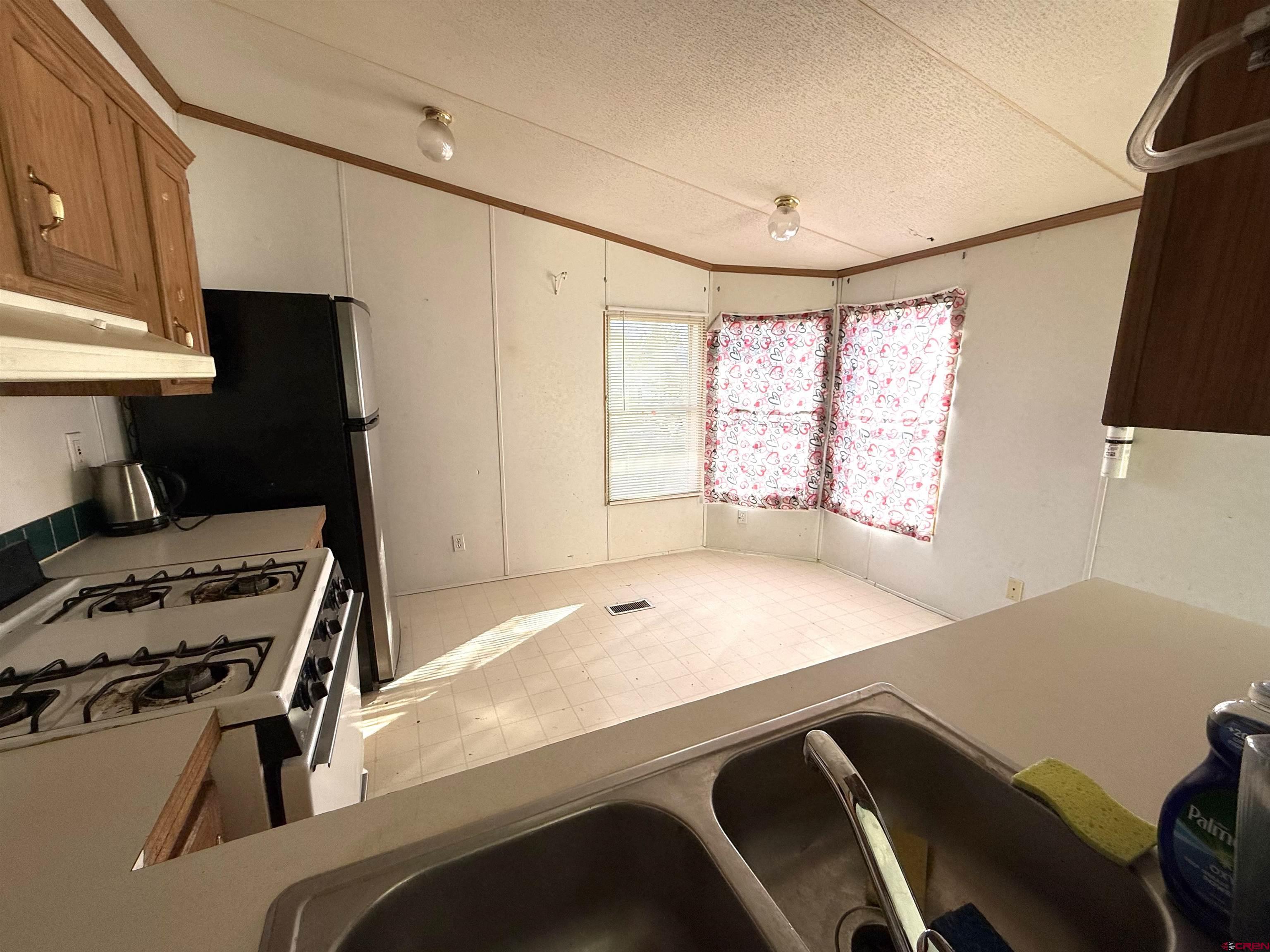 519 South Beech Street Cortez, CO 81321 - Photo 10 of 12 a room with a bed and a window