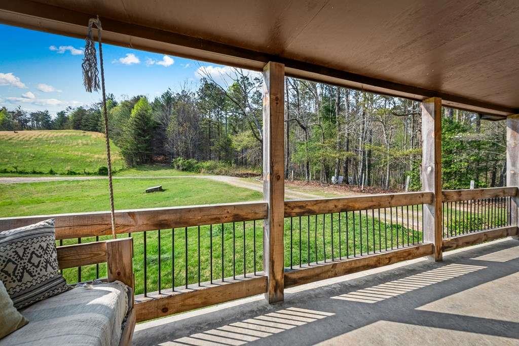384 Maxwell Road Blue Ridge, GA 30513 - Photo 35 of 68 a view of a porch with a yard