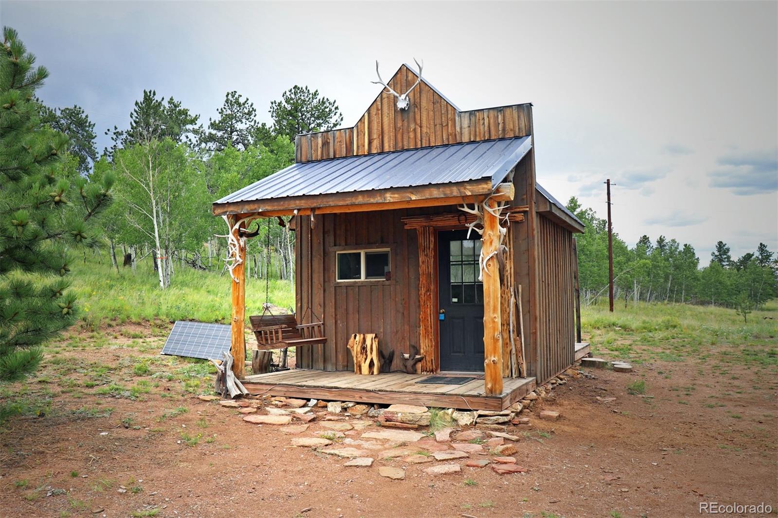 49 Pitchfork Road Hartsel, CO 80449 - Photo 1 of 28 a front view of a house with garden