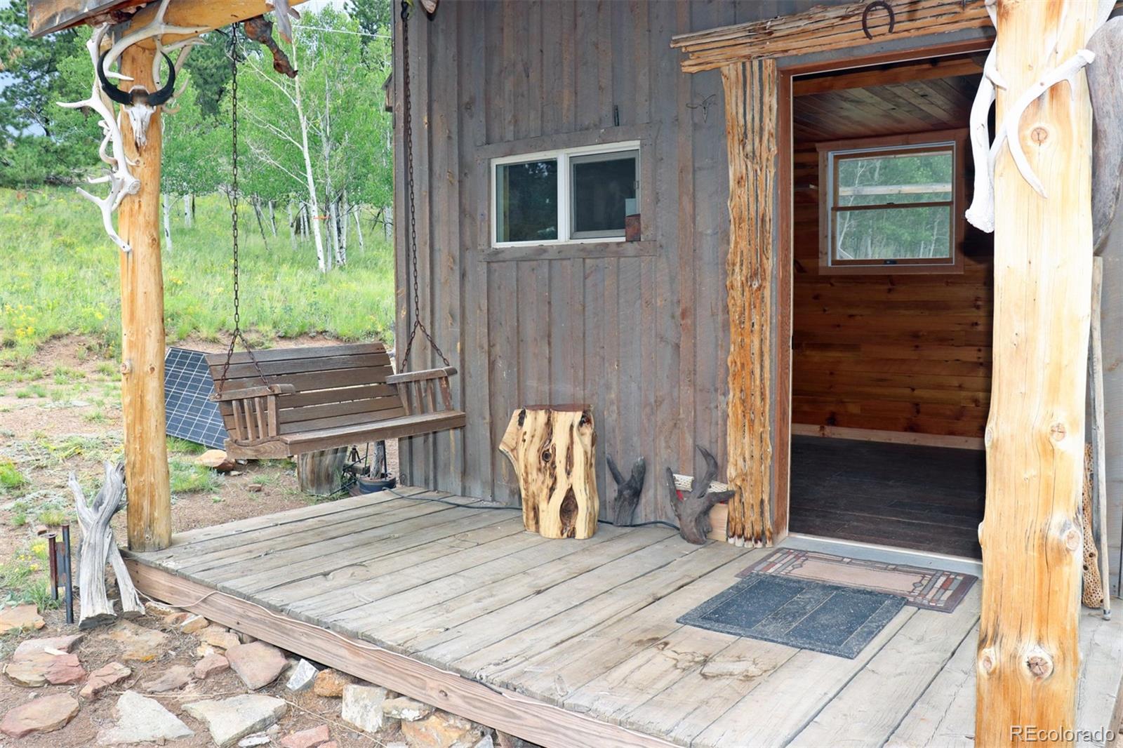 49 Pitchfork Road Hartsel, CO 80449 - Photo 5 of 28 a front view of a house with outdoor seating space