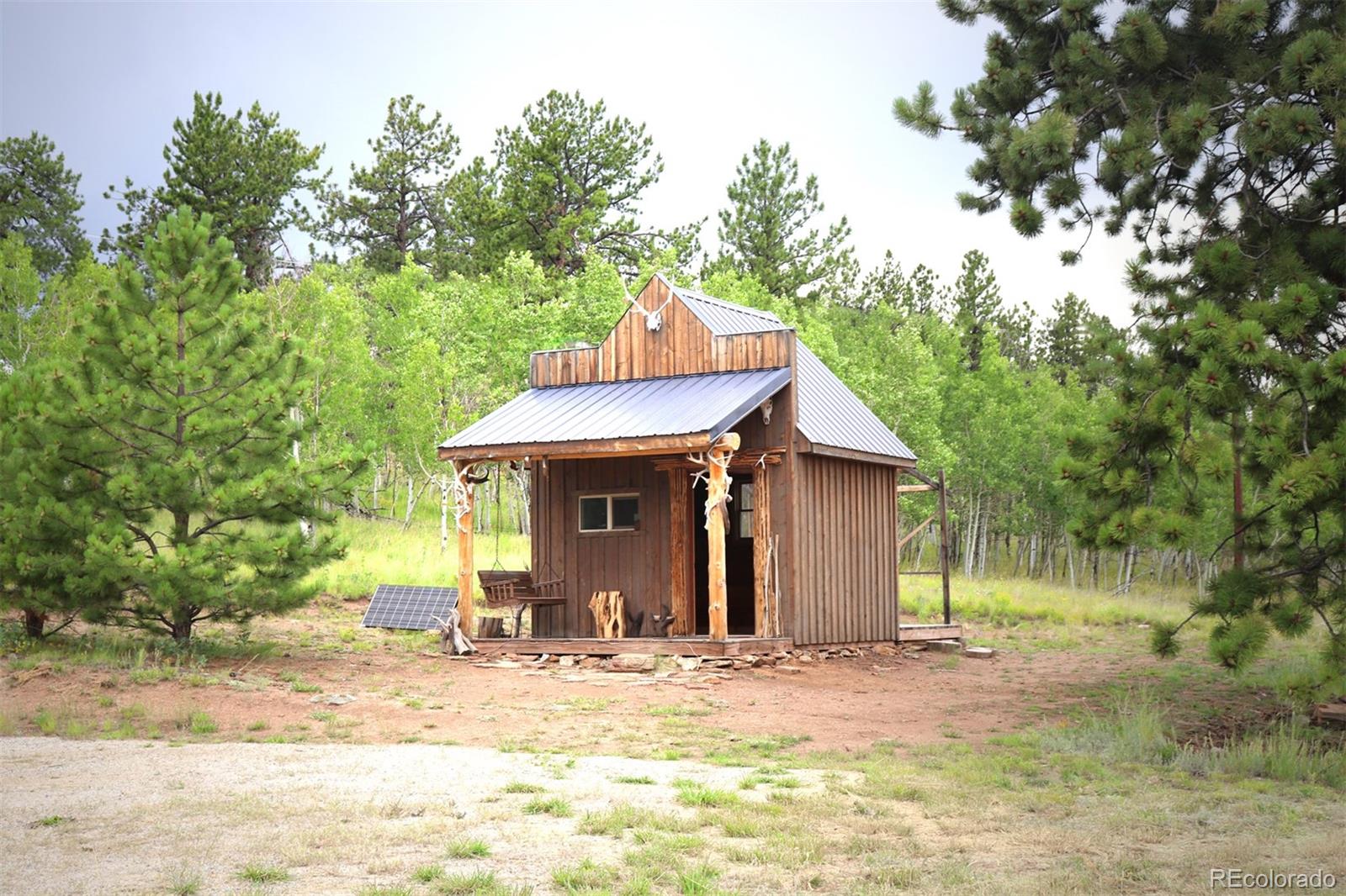 49 Pitchfork Road Hartsel, CO 80449 - Photo 9 of 28 a view of a house with backyard and trees