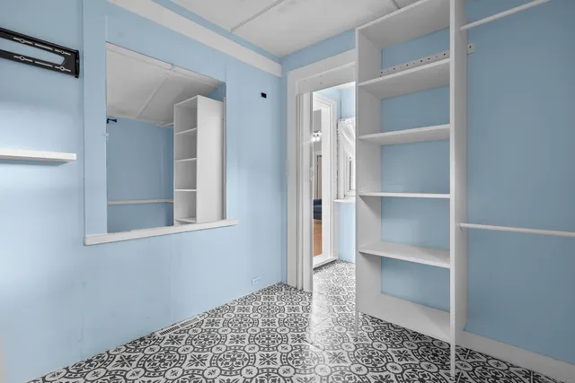a view of a room with a walk in closet
