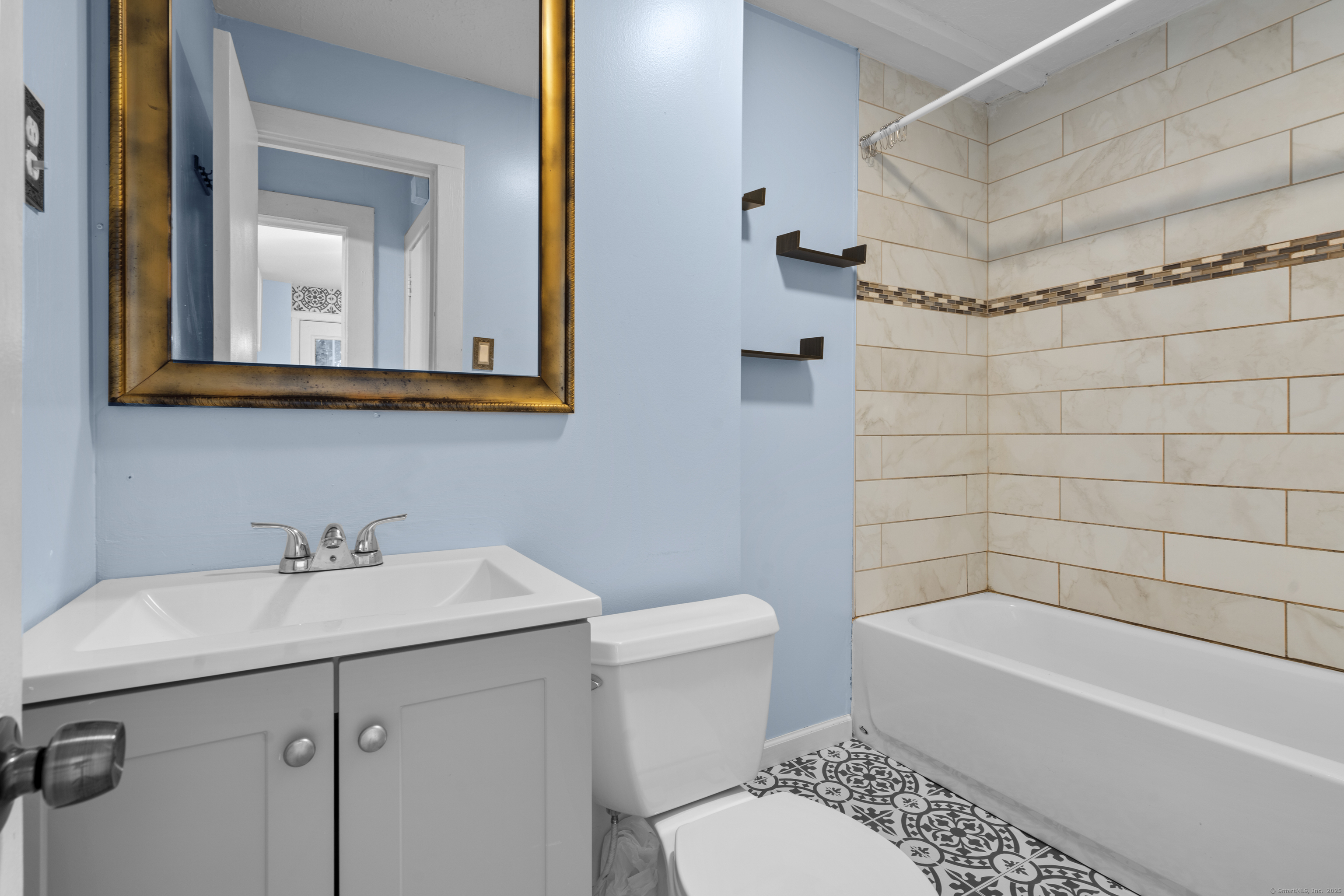 67 Elizabeth Avenue Bloomfield, CT 06002 - Photo 5 of 20 a bathroom with a sink a toilet and shower