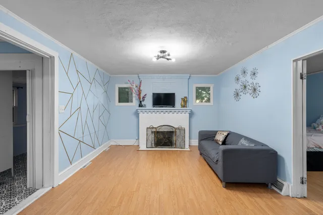 a living room with furniture and a fireplace