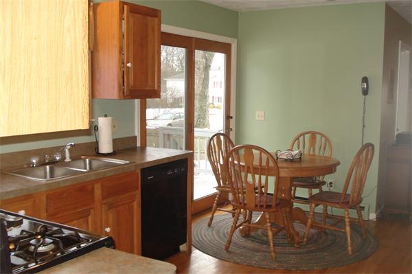 3221 Mendon Road Cumberland, RI 02864 - Photo 3 of 23 a kitchen with a table chairs and a window