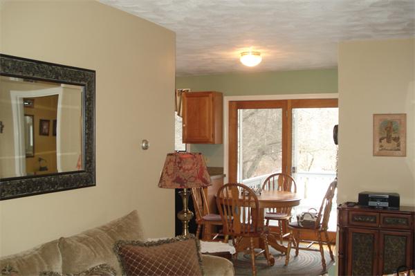 3221 Mendon Road Cumberland, RI 02864 - Photo 7 of 23 a living room with furniture and a floor to ceiling window