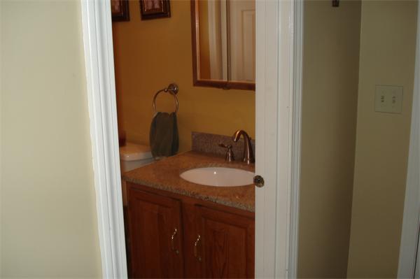 3221 Mendon Road Cumberland, RI 02864 - Photo 8 of 23 a bathroom with a granite countertop sink and a mirror