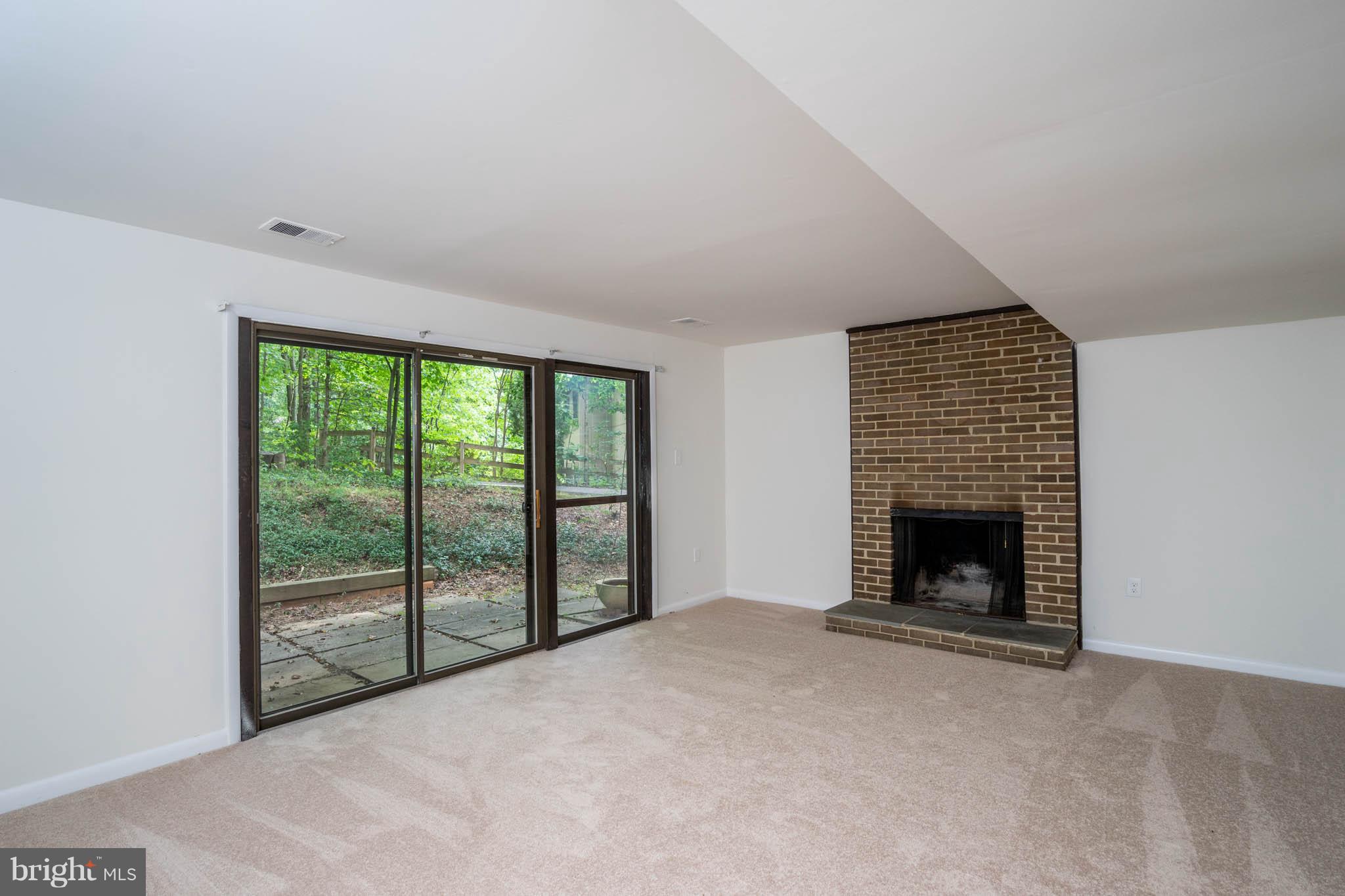 10986 Swansfield Road Columbia, MD 21044 - Photo 21 of 30 DOWNSTAIRS FAMILY ROOM WITH PATIO
