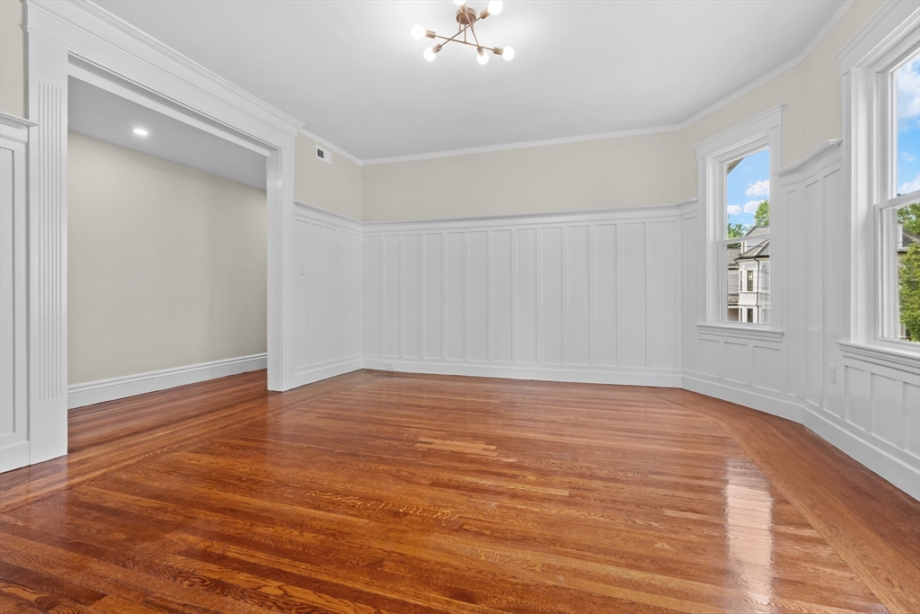 35 George Street, Unit 35 Newton, MA 02458 - Photo 12 of 36 wooden floor in an empty room with a window