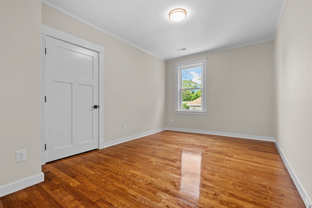 35 George Street, Unit 35 Newton, MA 02458 - Photo 21 of 36 a view of empty room with wooden floor and fan