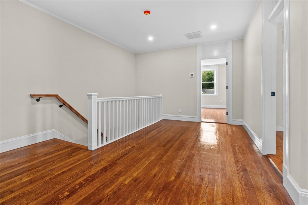 35 George Street, Unit 35 Newton, MA 02458 - Photo 22 of 36 a view of a room with wooden floor and window