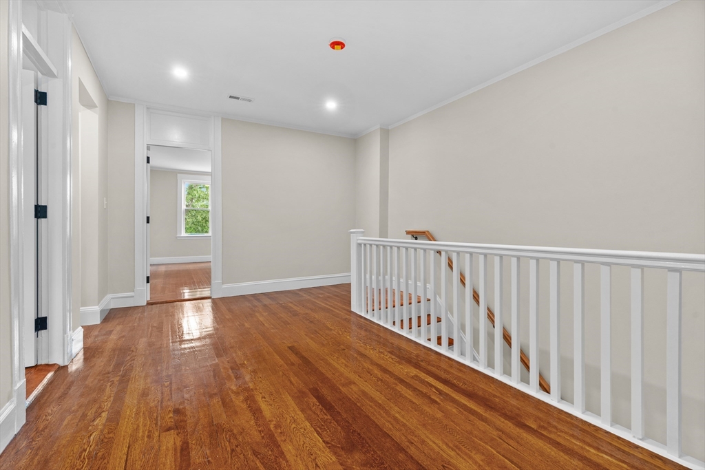 35 George Street, Unit 35 Newton, MA 02458 - Photo 24 of 36 a view of entryway with wooden floor