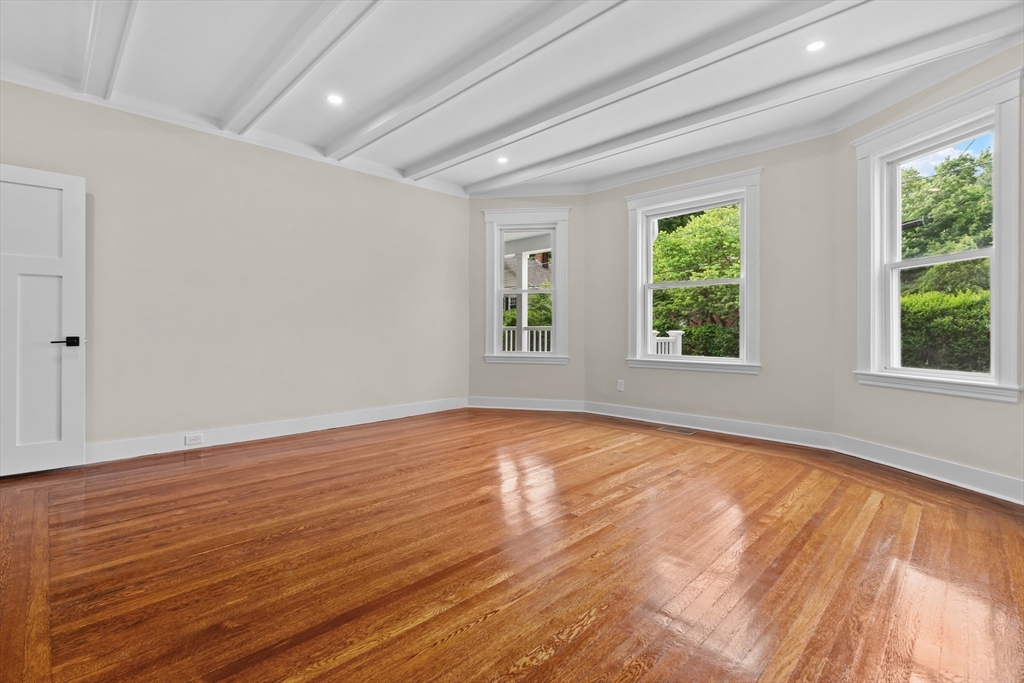 35 George Street, Unit 35 Newton, MA 02458 - Photo 3 of 36 a view of an empty room with wooden floor and a window
