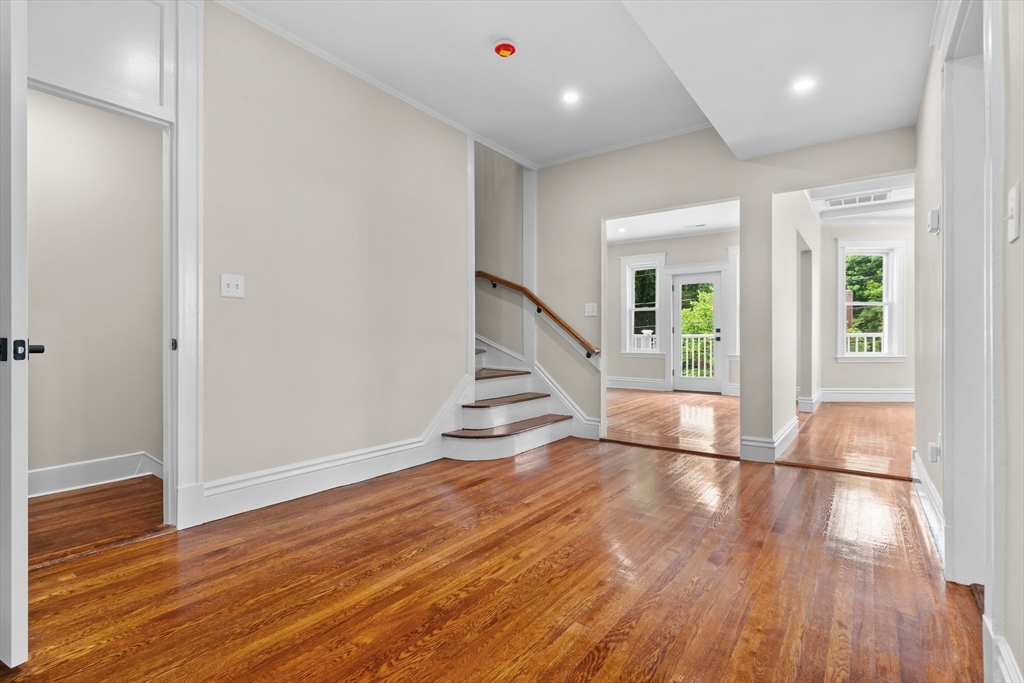 35 George Street, Unit 35 Newton, MA 02458 - Photo 10 of 36 an empty room with wooden floor and windows