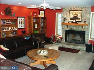 30 Valley Road Monroeville, NJ 08343 - Photo 3 of 12 a living room with furniture a fireplace and kitchen view