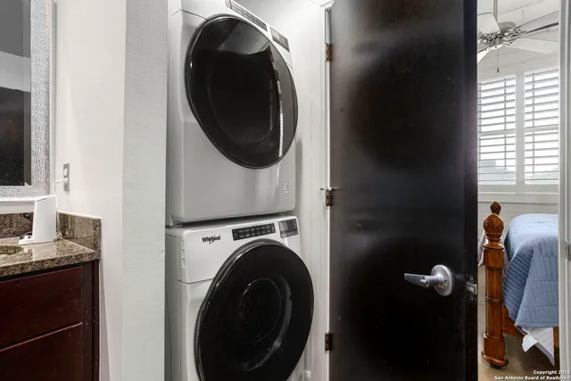 a close view of a utility room with dryer and washer