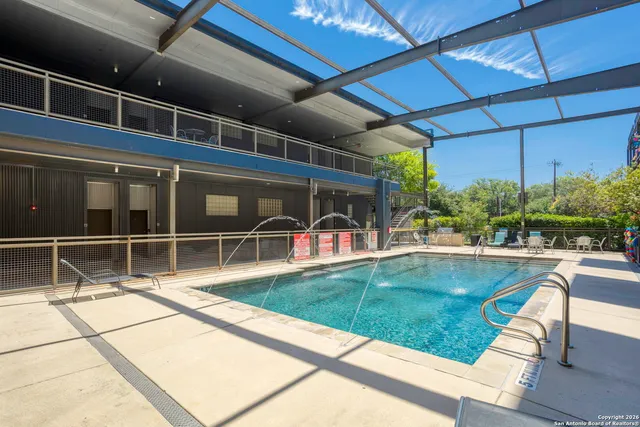a view of a swimming pool with a patio