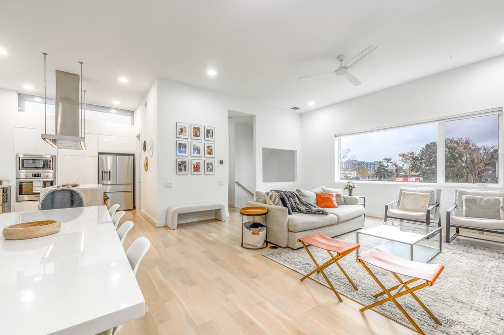 Simplistic Scandinavian Inspired Interior With Gallery Walls, Large Picture Windows & Wide Plank Custom Whitewashed Oak Flooring