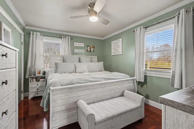 a bedroom with a bed and a table with closet