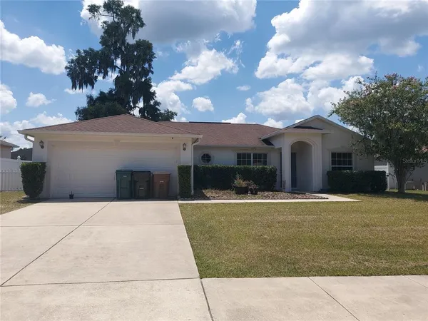 a front view of a house with yard