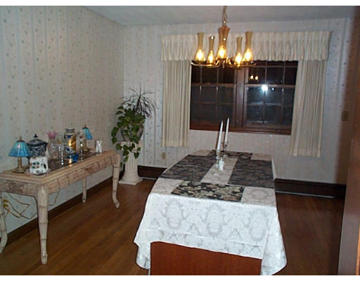 3 Coe Road Framingham, MA 01701 - Photo 4 of 8 a living room with furniture and a chandelier