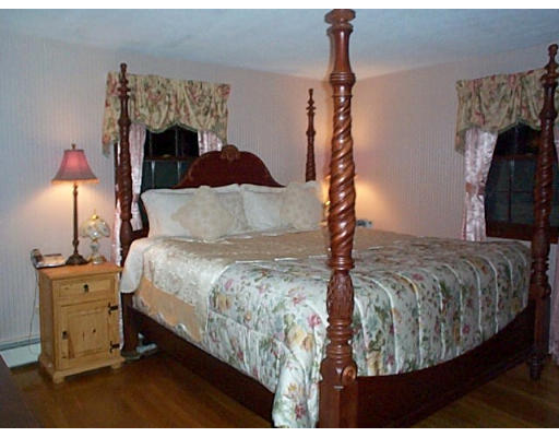 3 Coe Road Framingham, MA 01701 - Photo 6 of 8 a bedroom with a bed and a fireplace