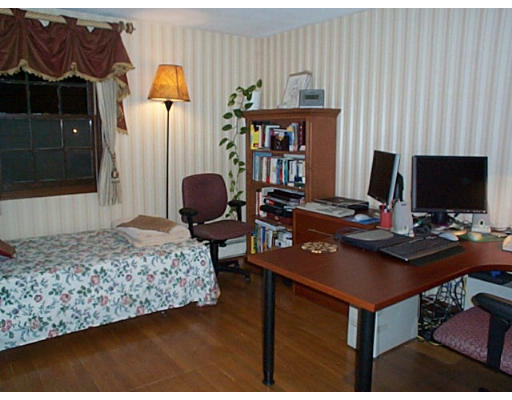 3 Coe Road Framingham, MA 01701 - Photo 8 of 8 a living room with furniture and a flat screen tv