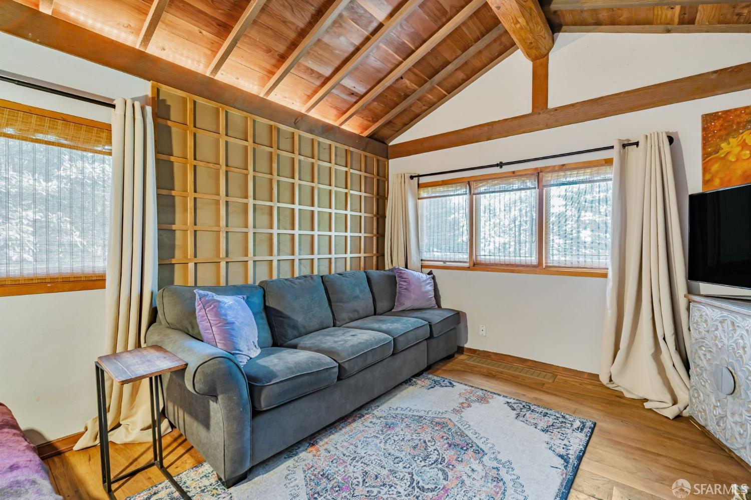 112 Marine Road Woodside, CA 94062 - Photo 15 of 22 a living room with furniture and a flat screen tv