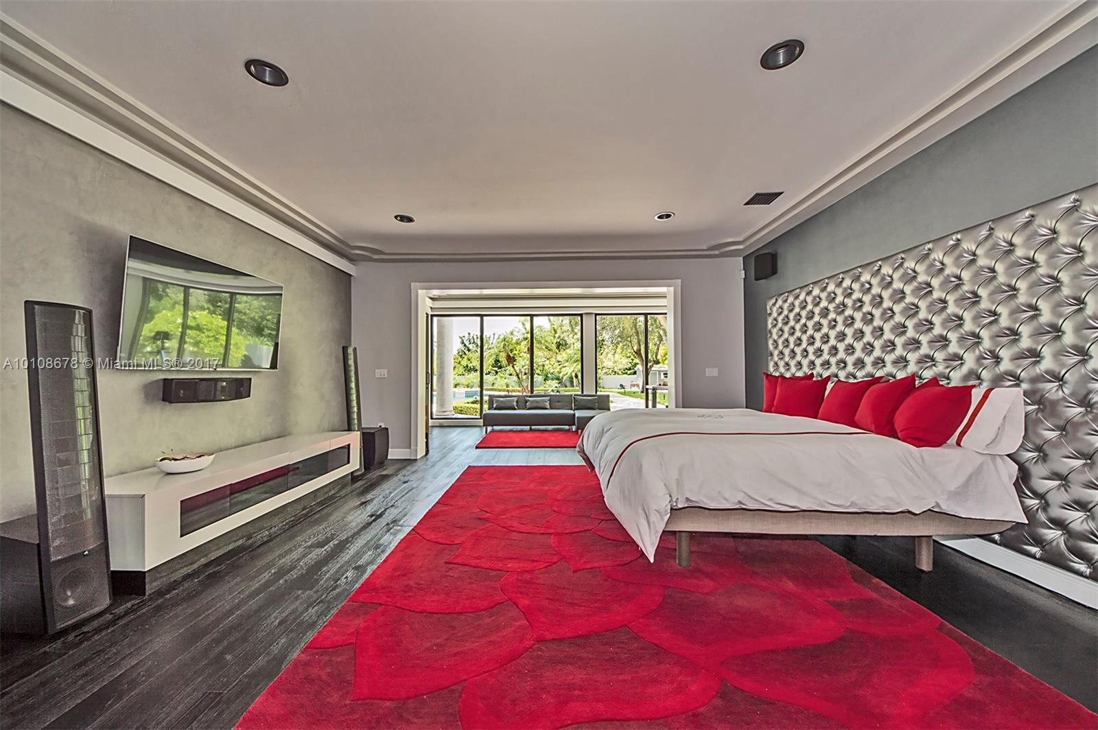 10270 Southwest 58th Street Miami, FL 33173 - Photo 14 of 35 a bed sitting in a bedroom next to a window