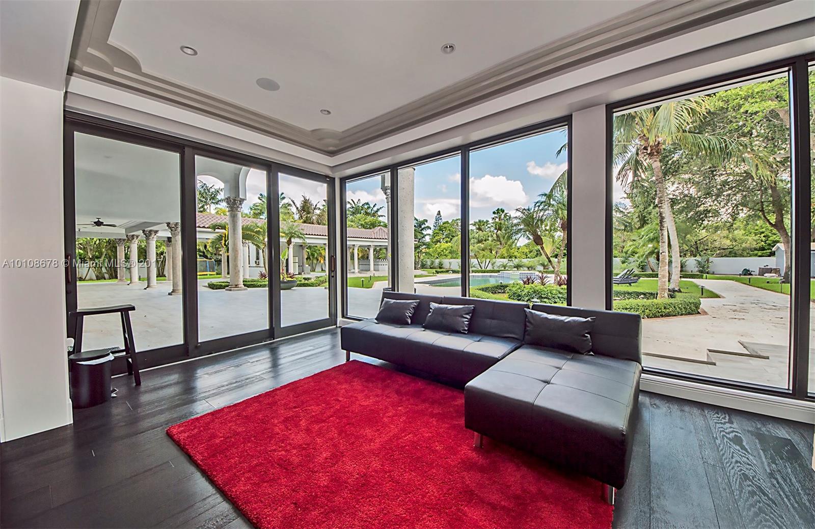 10270 Southwest 58th Street Miami, FL 33173 - Photo 16 of 35 a living room with furniture and a large window