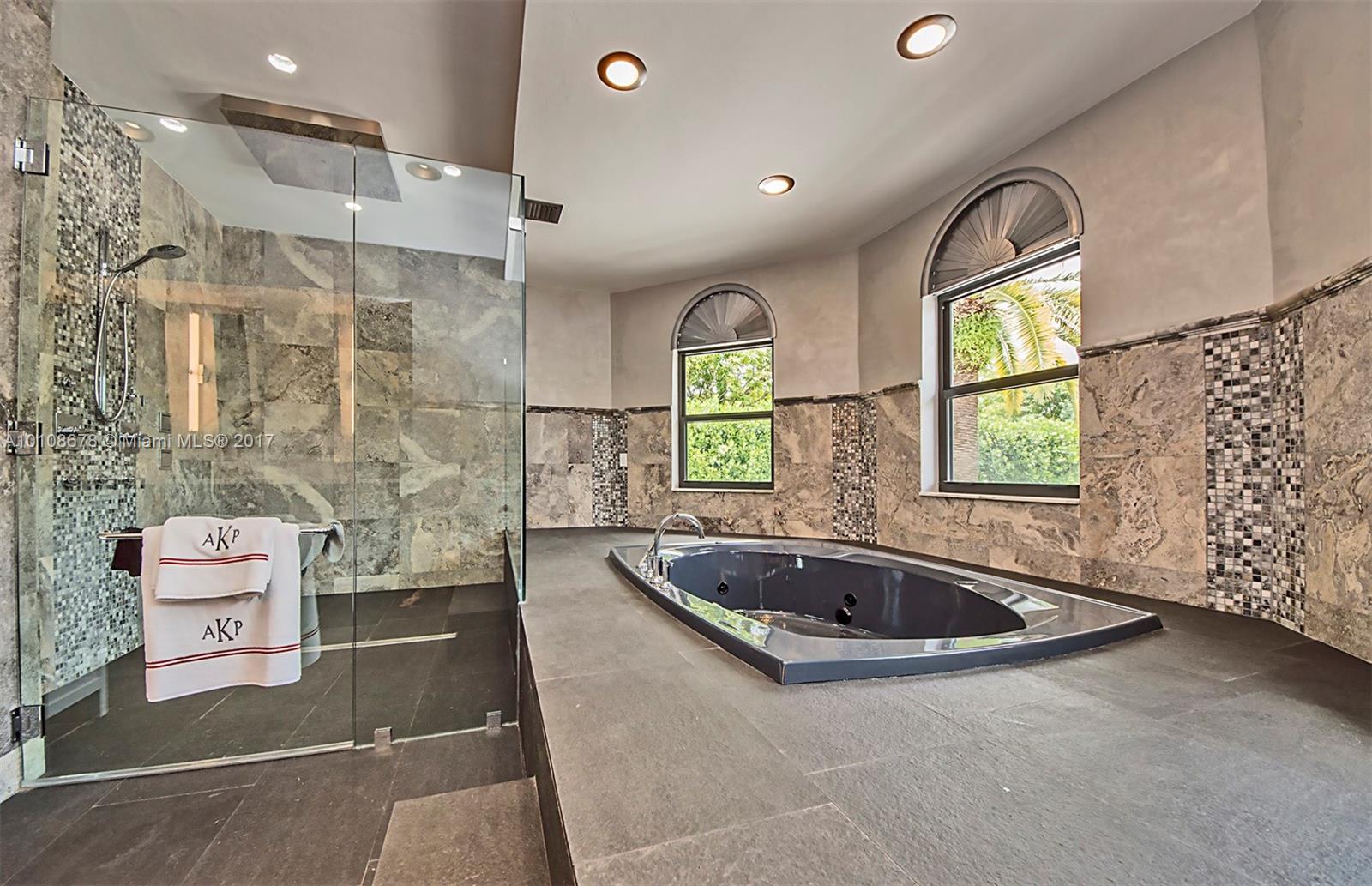 10270 Southwest 58th Street Miami, FL 33173 - Photo 19 of 35 a bathroom with a tub a sink and a window