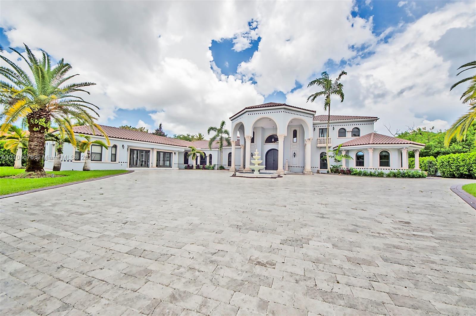 10270 Southwest 58th Street Miami, FL 33173 - Photo 2 of 35 a front view of a house with a garden