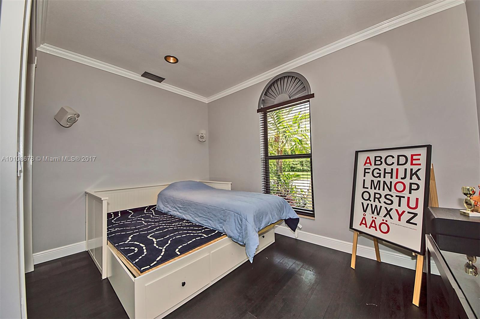 10270 Southwest 58th Street Miami, FL 33173 - Photo 22 of 35 a bedroom with a bed and a window