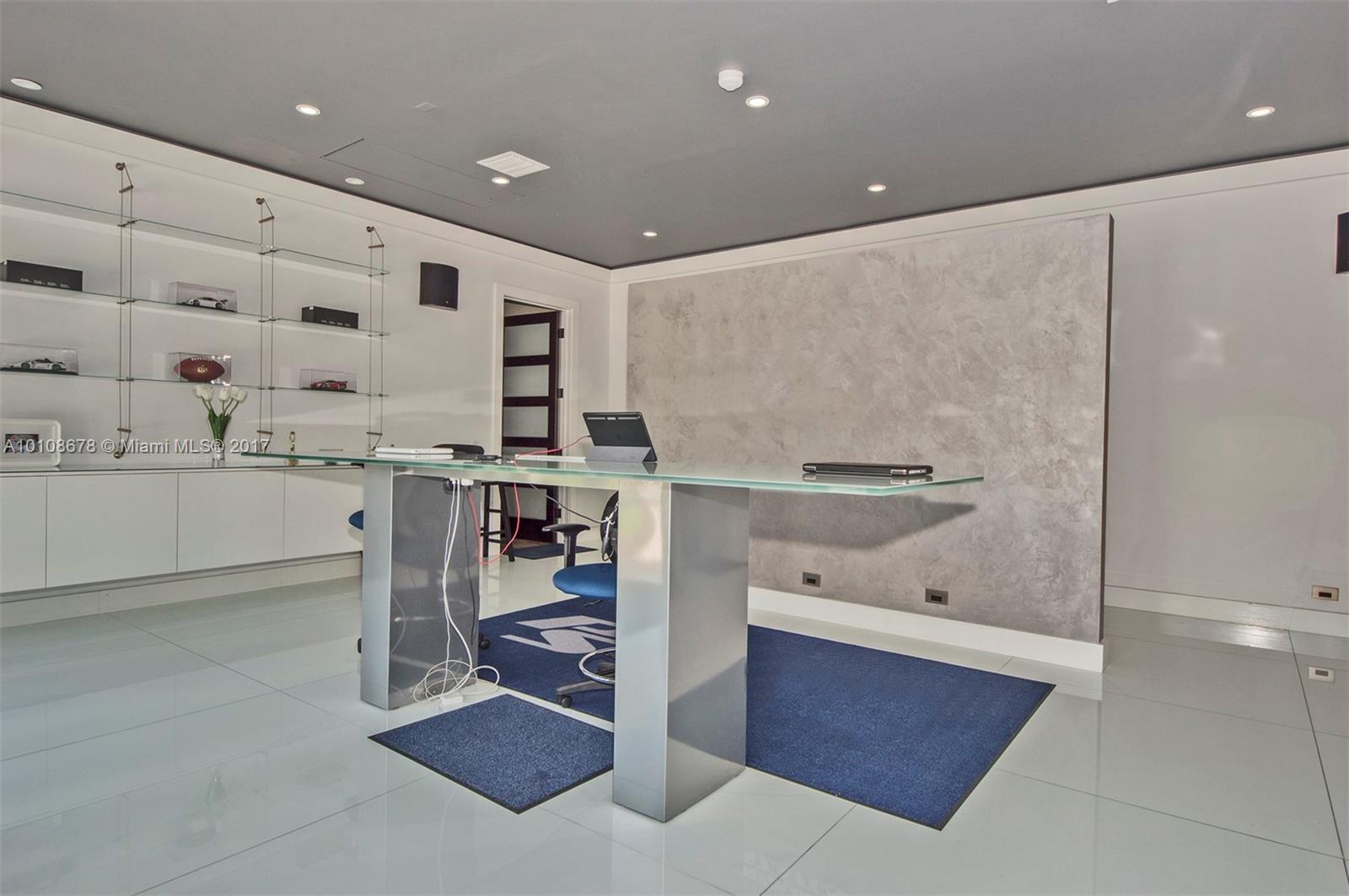 10270 Southwest 58th Street Miami, FL 33173 - Photo 23 of 35 a kitchen with stainless steel appliances kitchen island granite countertop a sink and cabinets