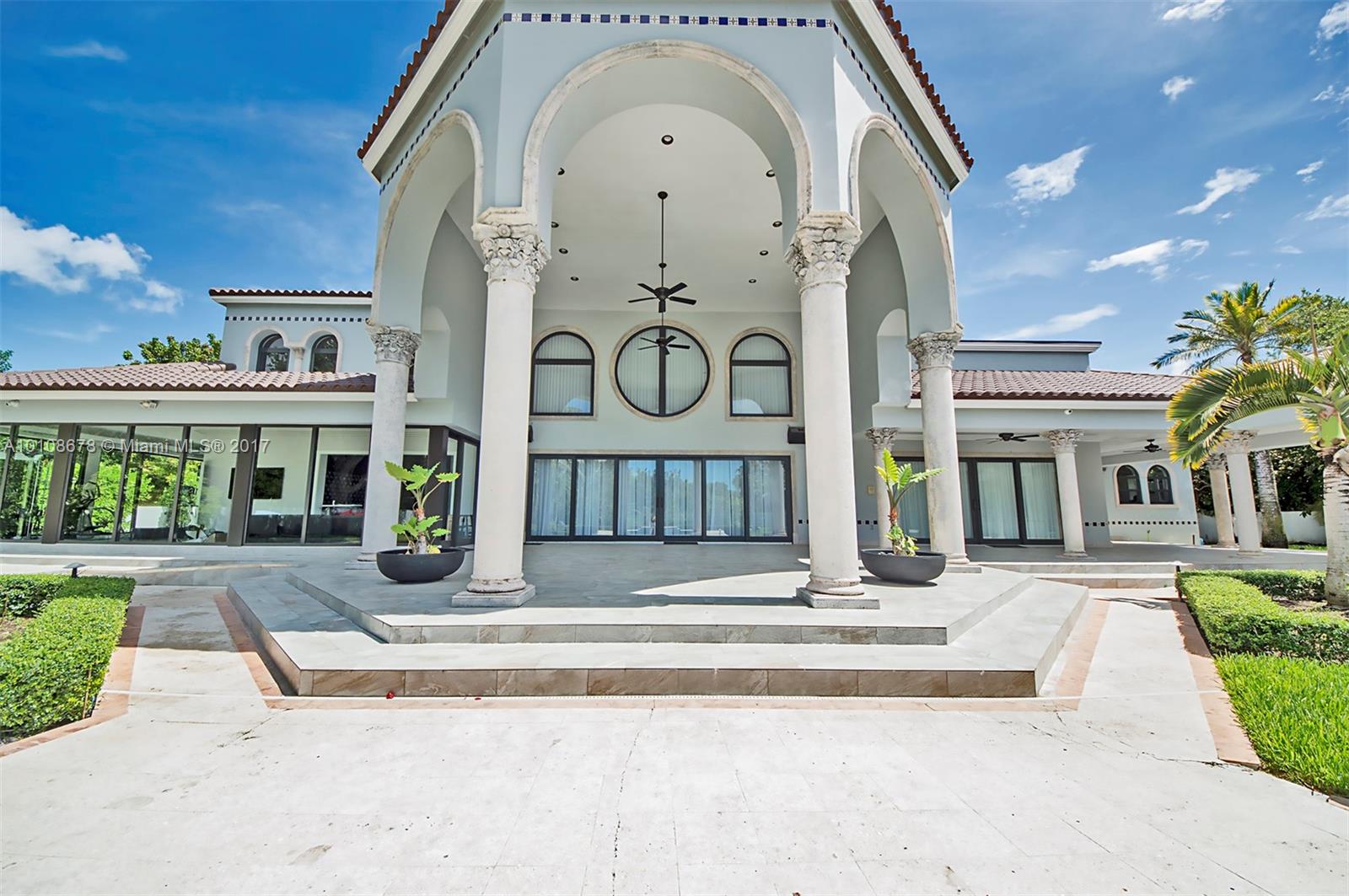 10270 Southwest 58th Street Miami, FL 33173 - Photo 31 of 35 a front view of a building with a garden