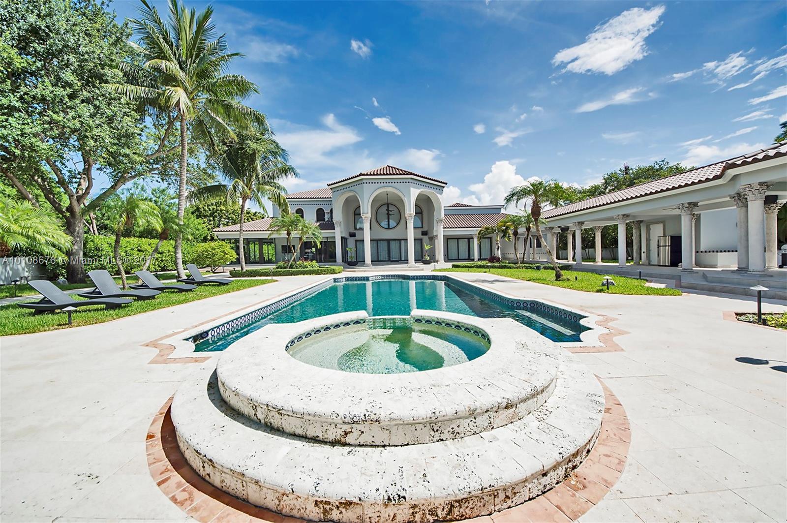 10270 Southwest 58th Street Miami, FL 33173 - Photo 32 of 35 a view of a house with swimming pool and a yard