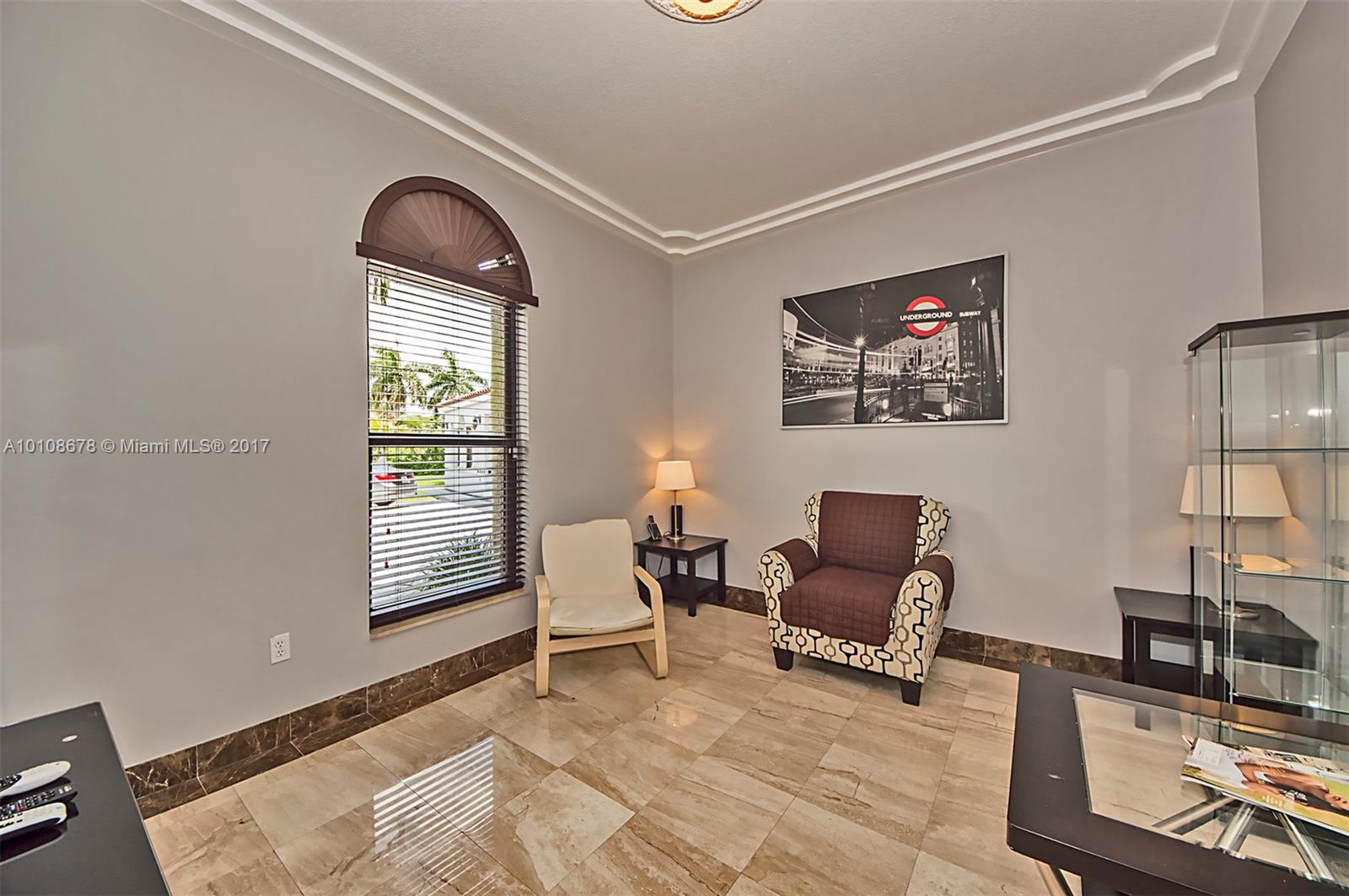 10270 Southwest 58th Street Miami, FL 33173 - Photo 9 of 35 a living room with furniture and a window