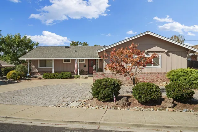 front view of a house with a garden