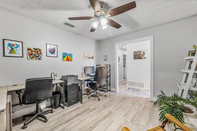 a view of a workspace with furniture and a workspace