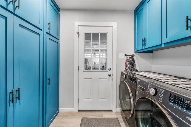 a view of storage and utility room with washer and dryer