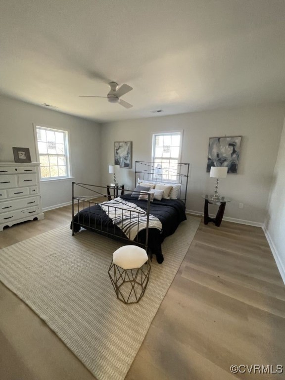 471 Pedro Pitts Road Caret, VA 22436 - Photo 17 of 19 Bedroom with a ceiling fan, multiple windows, base